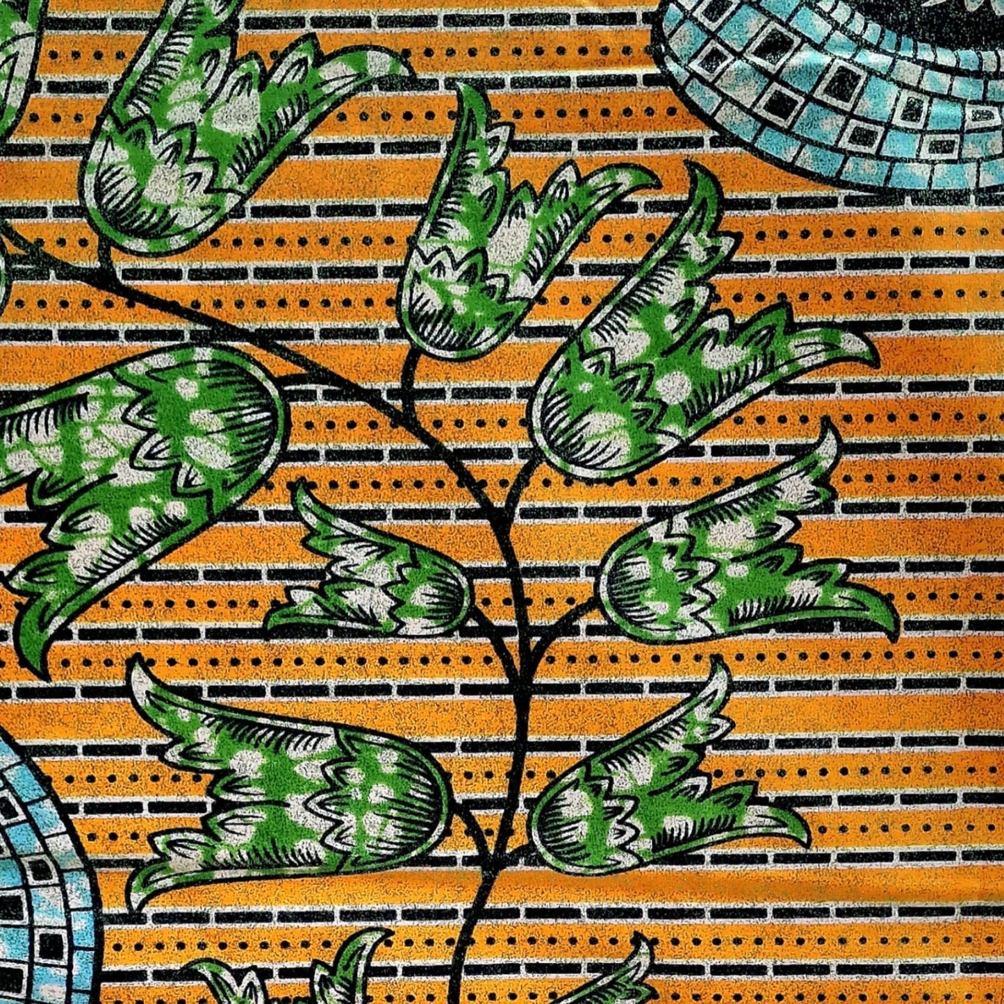 A close-up of a embellished duchess print featuring green and white patterned tulip flowers on a yellow-orange striped background with black stems.
