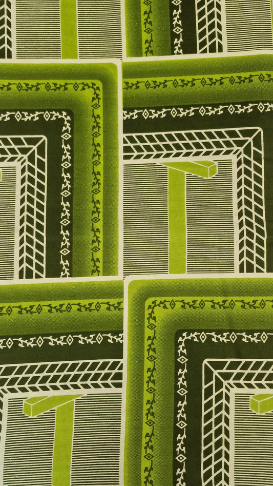 African Wax print featuring a retro geometric pattern in shades of green, olive, and white. The pattern consists of nested rectangular frames with striped and textured details