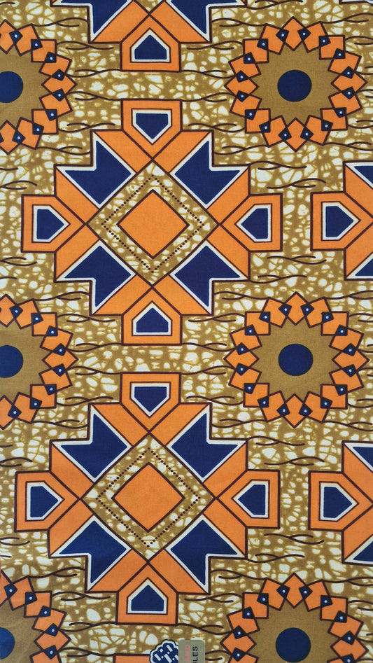 A folded piece of African wax print fabric with a geometric pattern in orange, navy blue, beige, and brown, featuring a batik-style design with circular medallions and starburst motifs.