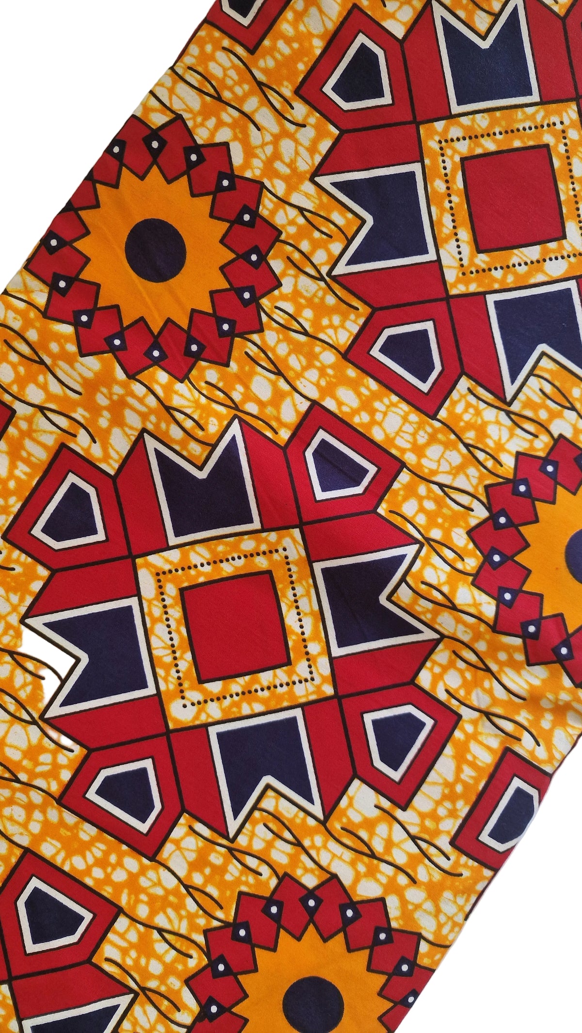 African wax fabric featuring a bold geometric and floral-inspired print in orange, red, navy, black, and white.